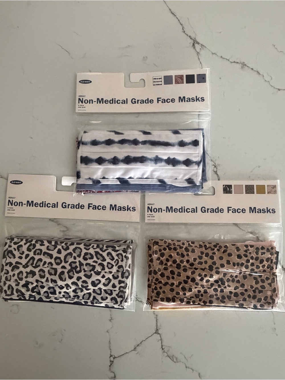 A Bundle of 15 masks pink leopard, white and black leopard and white and blue